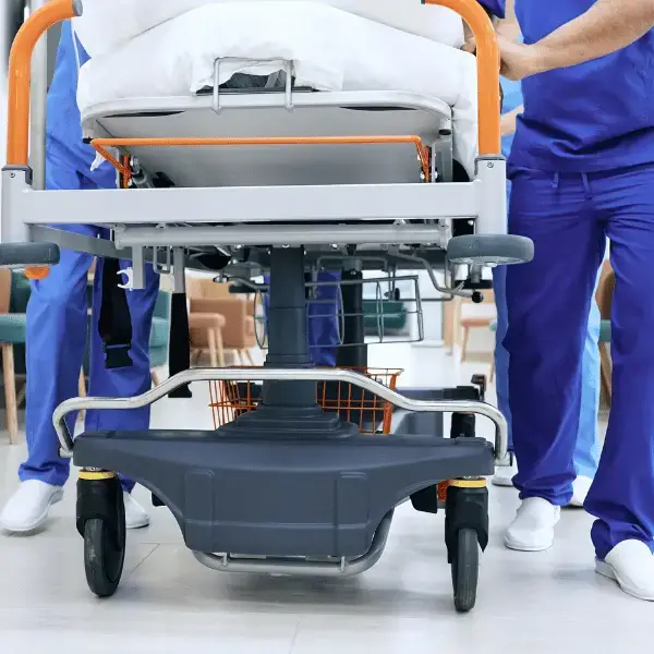Medical team moving a patient on a stretcher in the Emergency Department at Nazarenus Hospital Bulacan