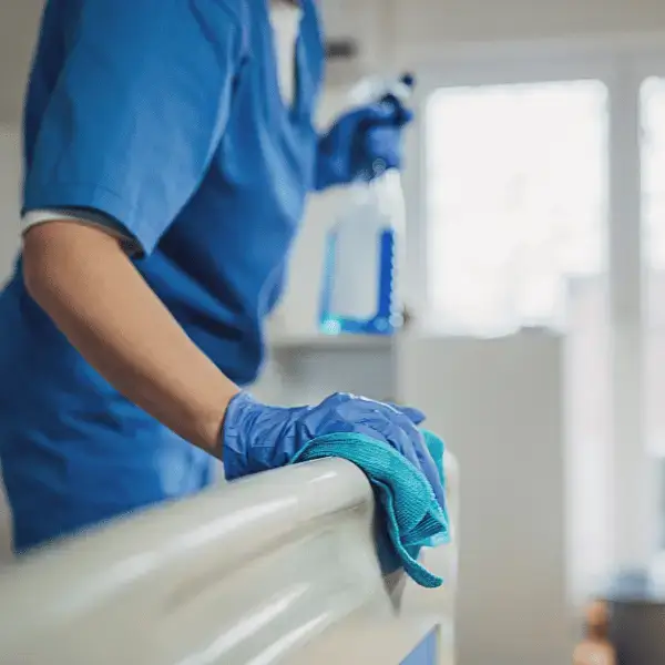 Hospital maintenance staff cleaning and disinfecting a patient room at Nazarenus Hospital Bulacan