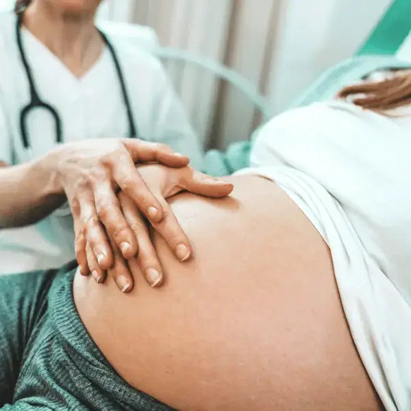 Obstetrician checking a pregnant woman during prenatal consultation at Nazarenus Hospital Bulacan